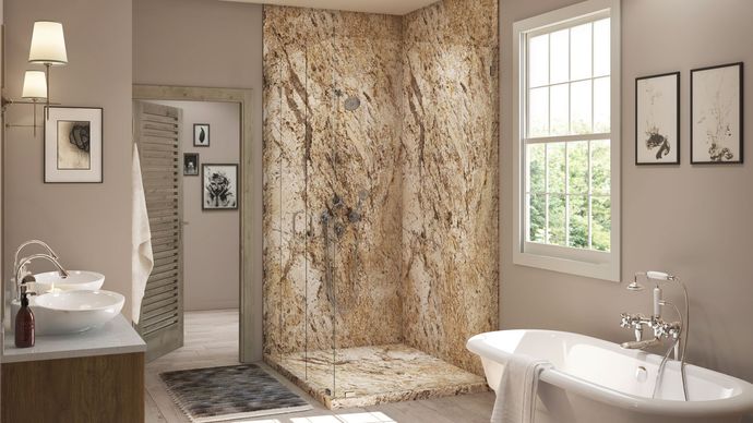 A bathroom with a walk in shower , tub , sink and window.