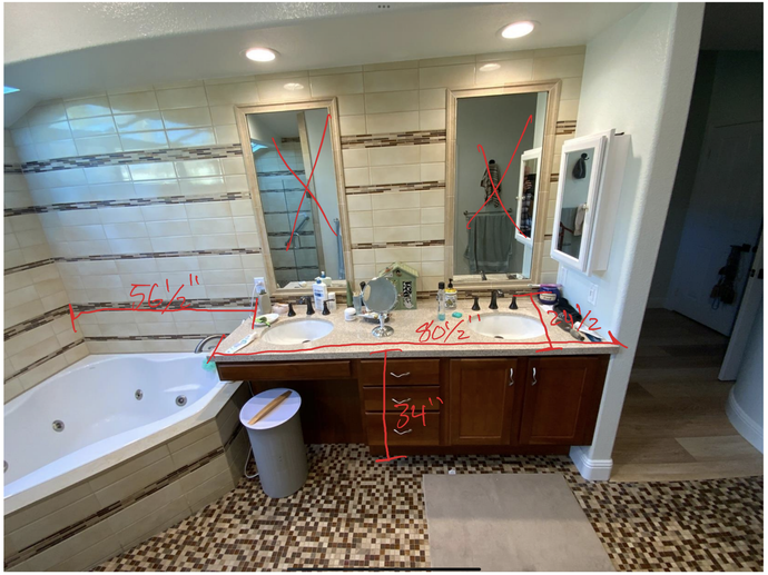 A bathroom with two sinks , a tub and two mirrors.