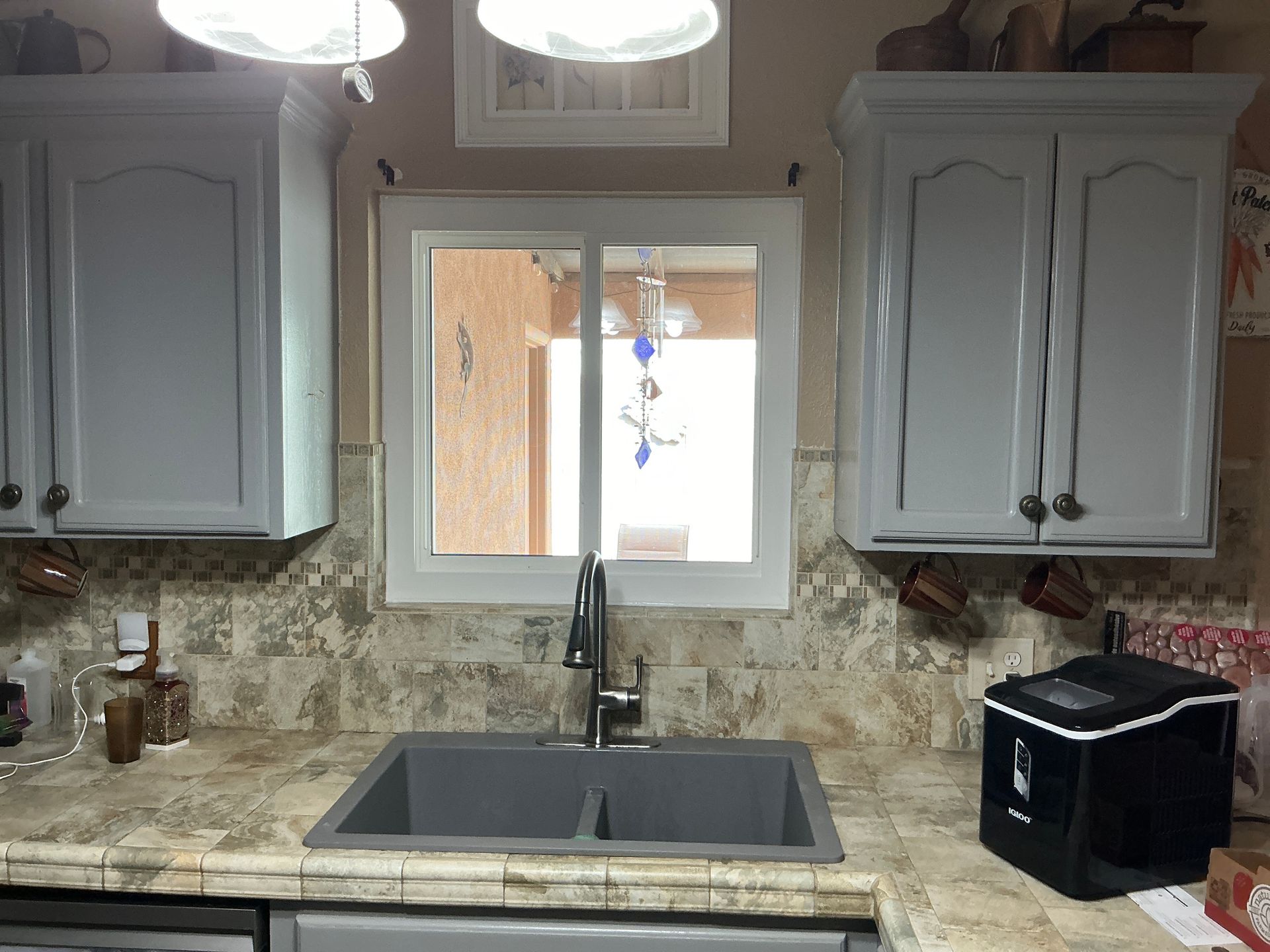 Compact bathroom with natural light and neutral colors maximizing space.