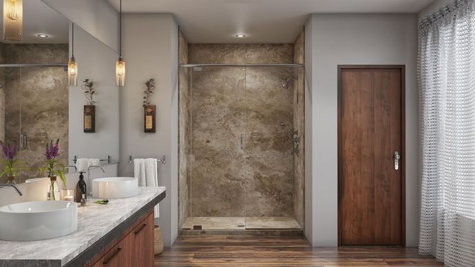 A bathroom with two sinks and a walk in shower.