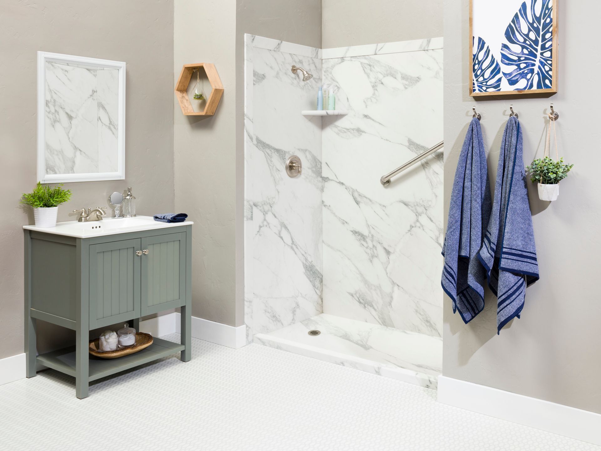 A bathroom with a sink , mirror , and shower.