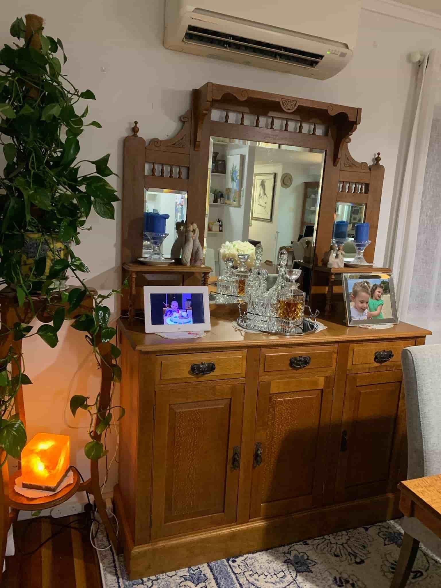 A Wooden Dresser With a Mirror on Top of It in a Living Room — The Restoration Barn In Te Kowai, QLD
