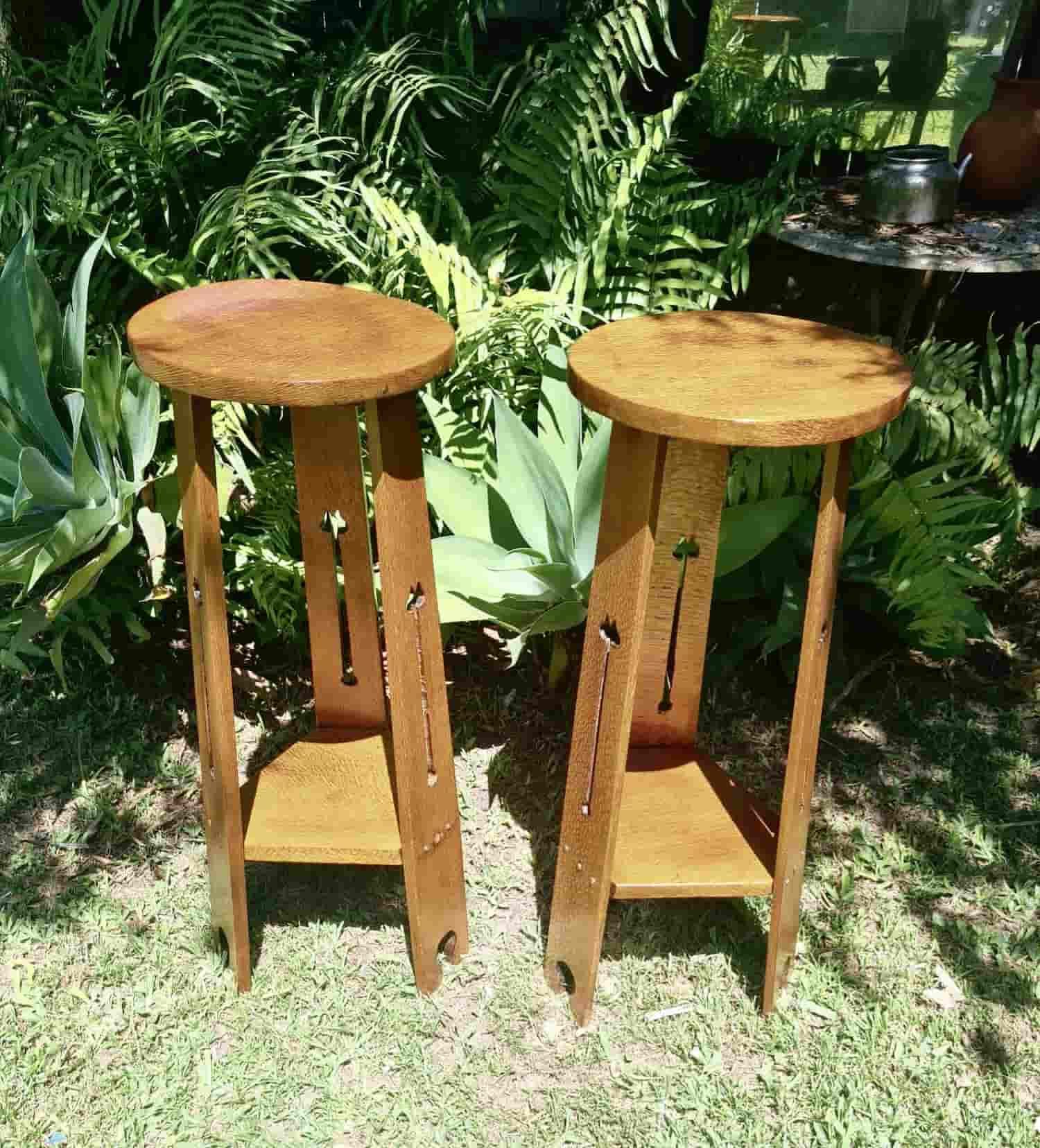 Two Wooden Stools Are Sitting on Top of a Lush Green Field — The Restoration Barn In Te Kowai, QLD