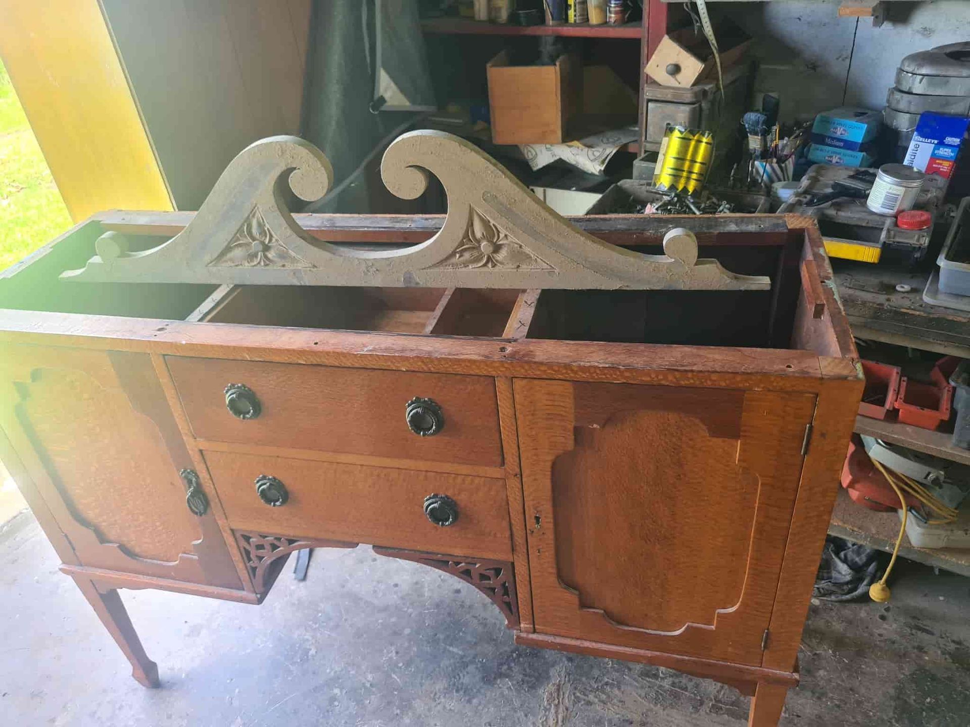 A Wooden Dresser With Drawers and Cabinets is Sitting in a Garage — The Restoration Barn In Te Kowai, QLD