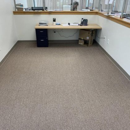 There is a desk in the middle of the room.