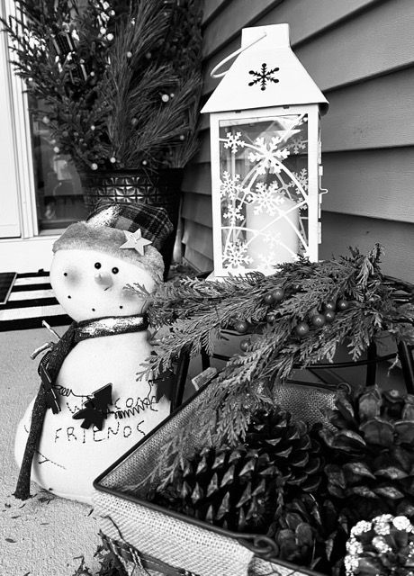A black and white photo of a snowman that says friends