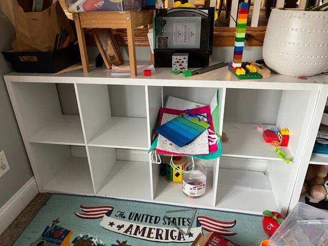 A white shelf with a sign that says united states of america on it