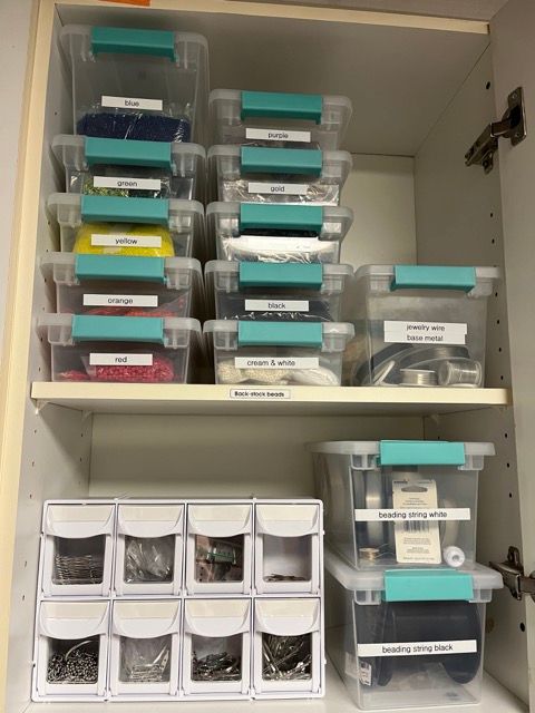 A shelf filled with lots of plastic containers with labels on them