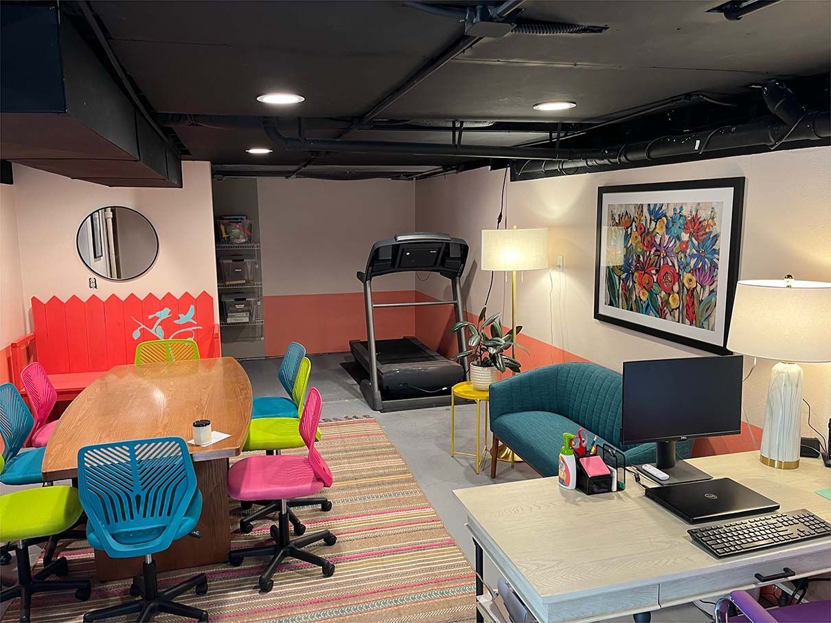 There is a treadmill in the corner of the room.