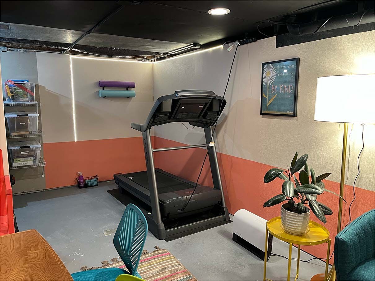 There is a treadmill in the middle of the room.