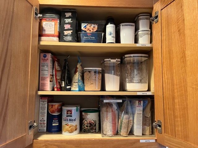 A kitchen cabinet filled with a variety of food items.
