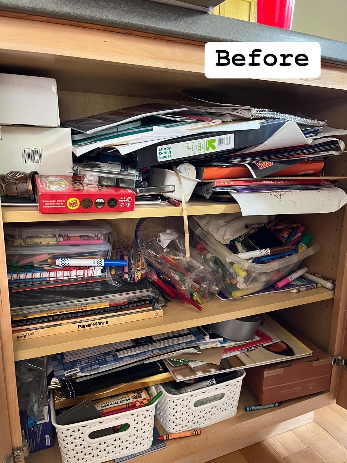 A before picture of a shelf filled with lots of items.