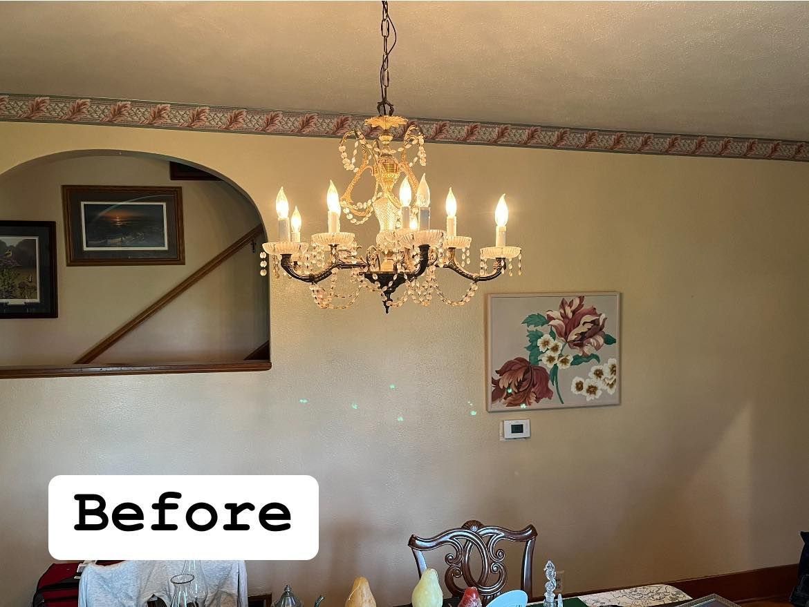 A before picture of a dining room with a chandelier hanging from the ceiling