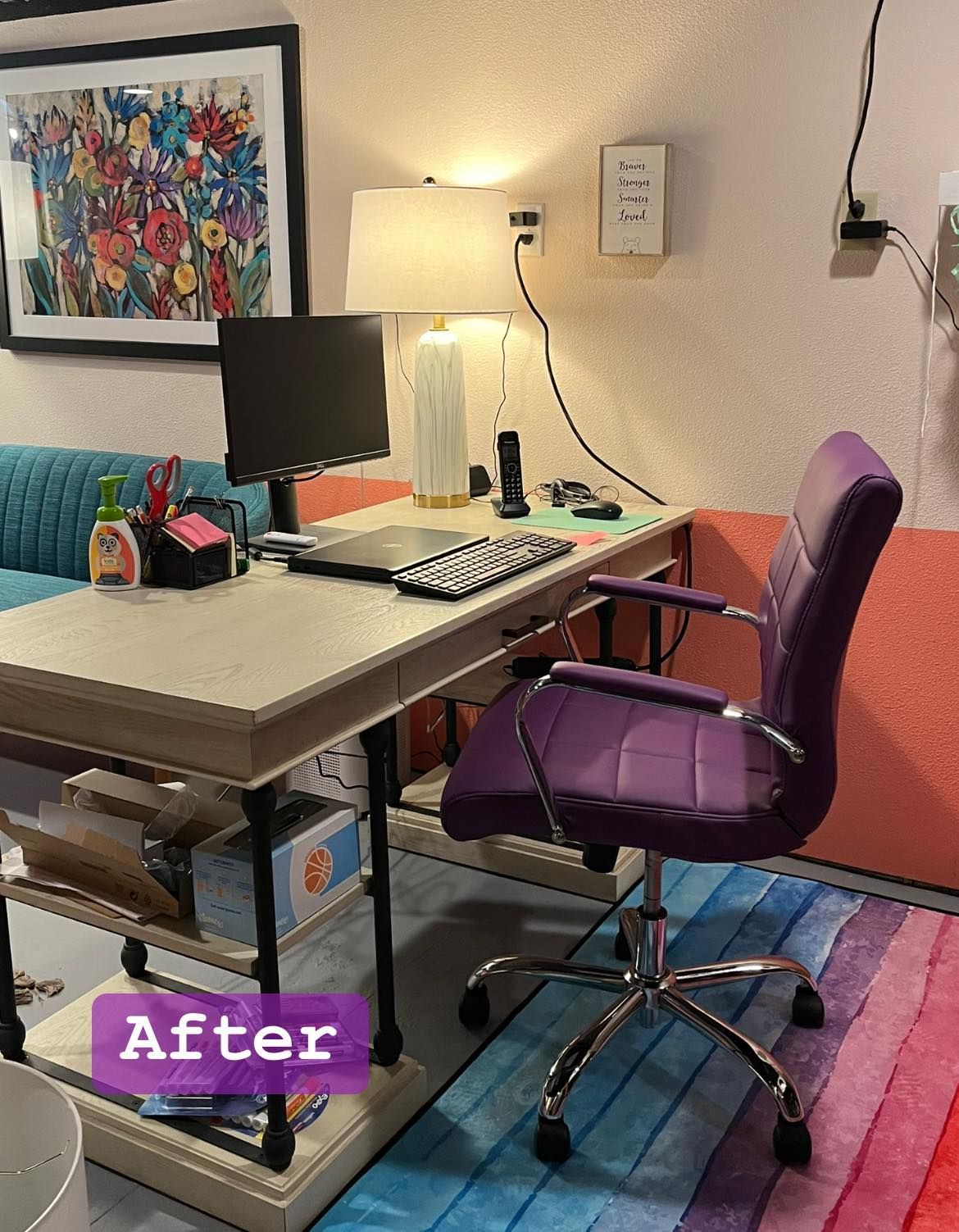 A purple chair is sitting in front of a desk with a computer on it.