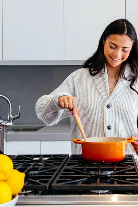 Woman Cooking — Supplements & Organic Produce in Mid North Coast, NSW