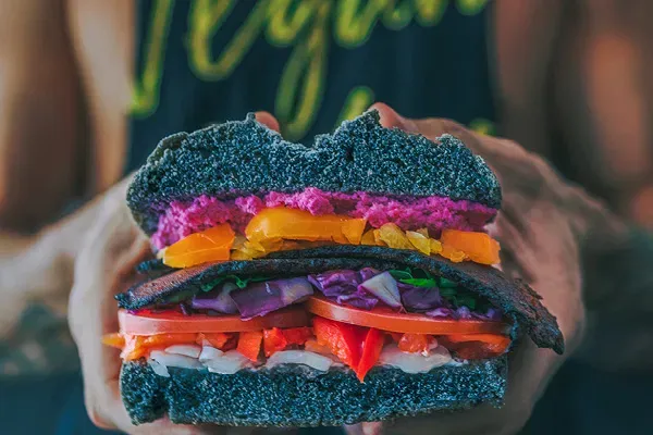 Hand Of Woman Applying Oil — Supplements & Organic Produce in Mid North Coast, NSW