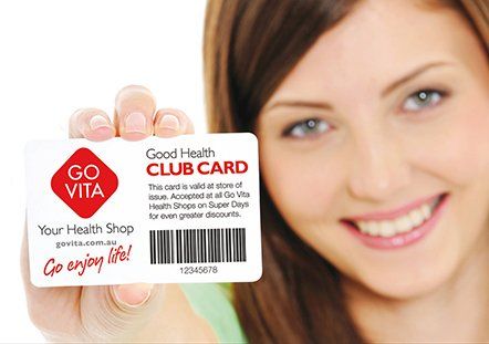 Woman Showing Membership Card — Supplements & Organic Produce in Mid North Coast, NSW