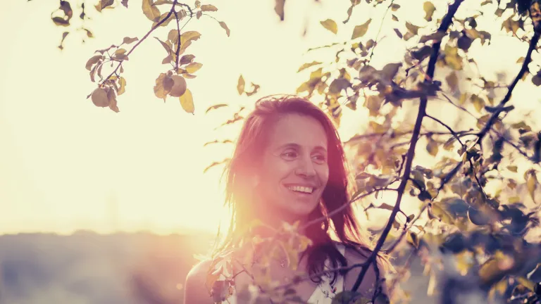 Woman Smiling in the Sunshine — Supplements & Organic Produce in Mid North Coast, NSW