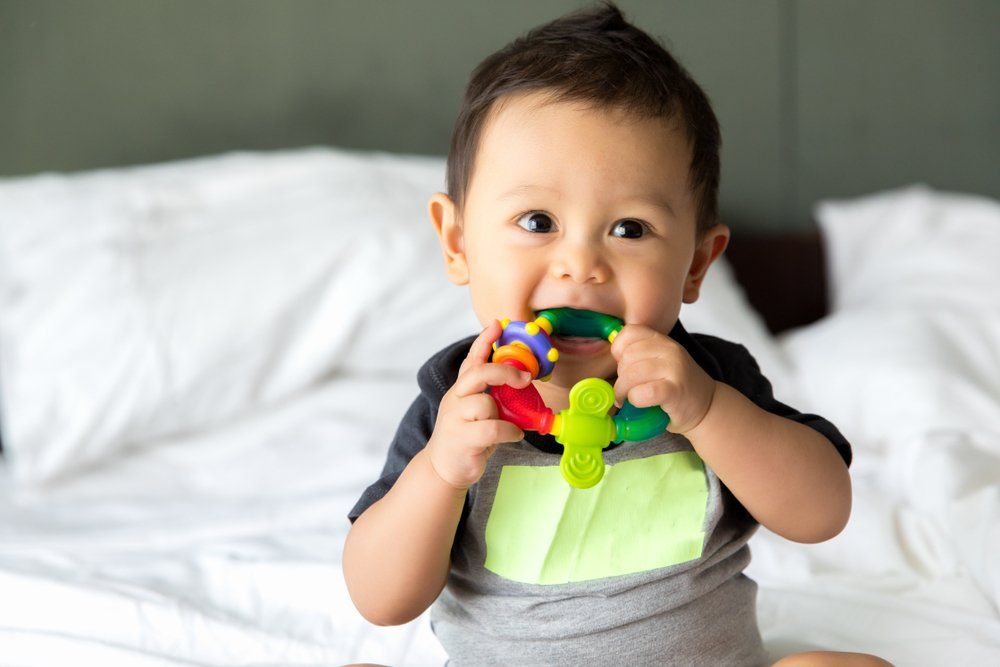 Child Chewing a Toy — Baby Goods in Mid North Coast, NSW