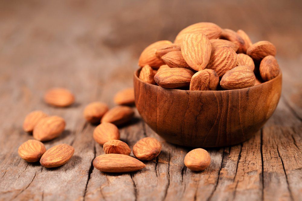 Almonds in Brown Wooden Bowl — Health Food Store in Taree, NSW