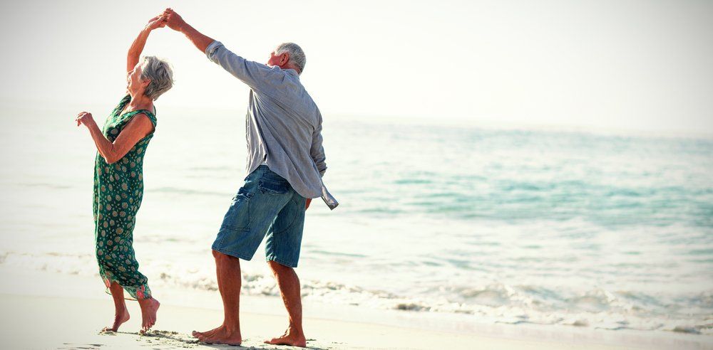Couple dancing on beach — Supplements & Organic Produce in Mid North Coast, NSW