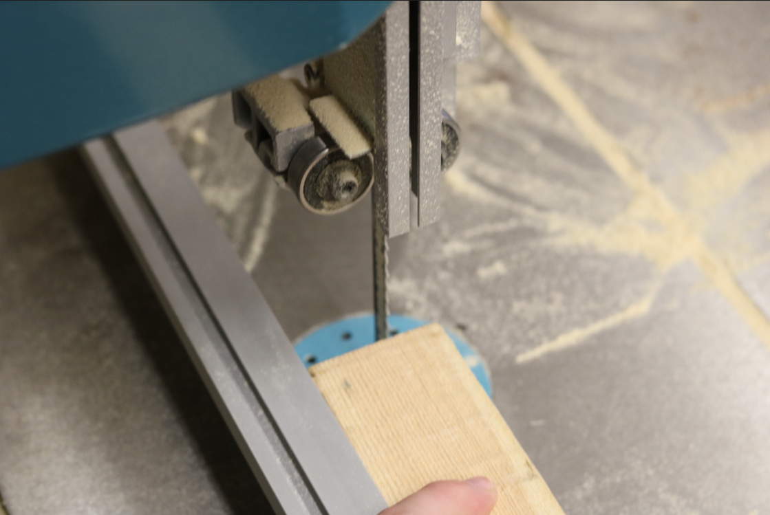Close up image of a saw cutting wood in a workshop building windows