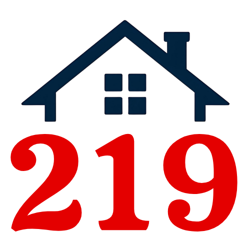 A red and black triangle with a house in the middle.