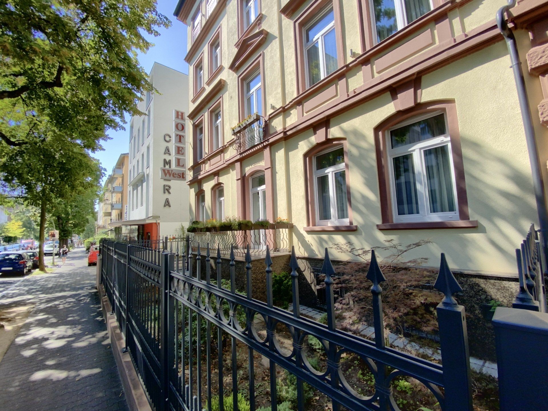 A building with a wrought iron fence in front of it