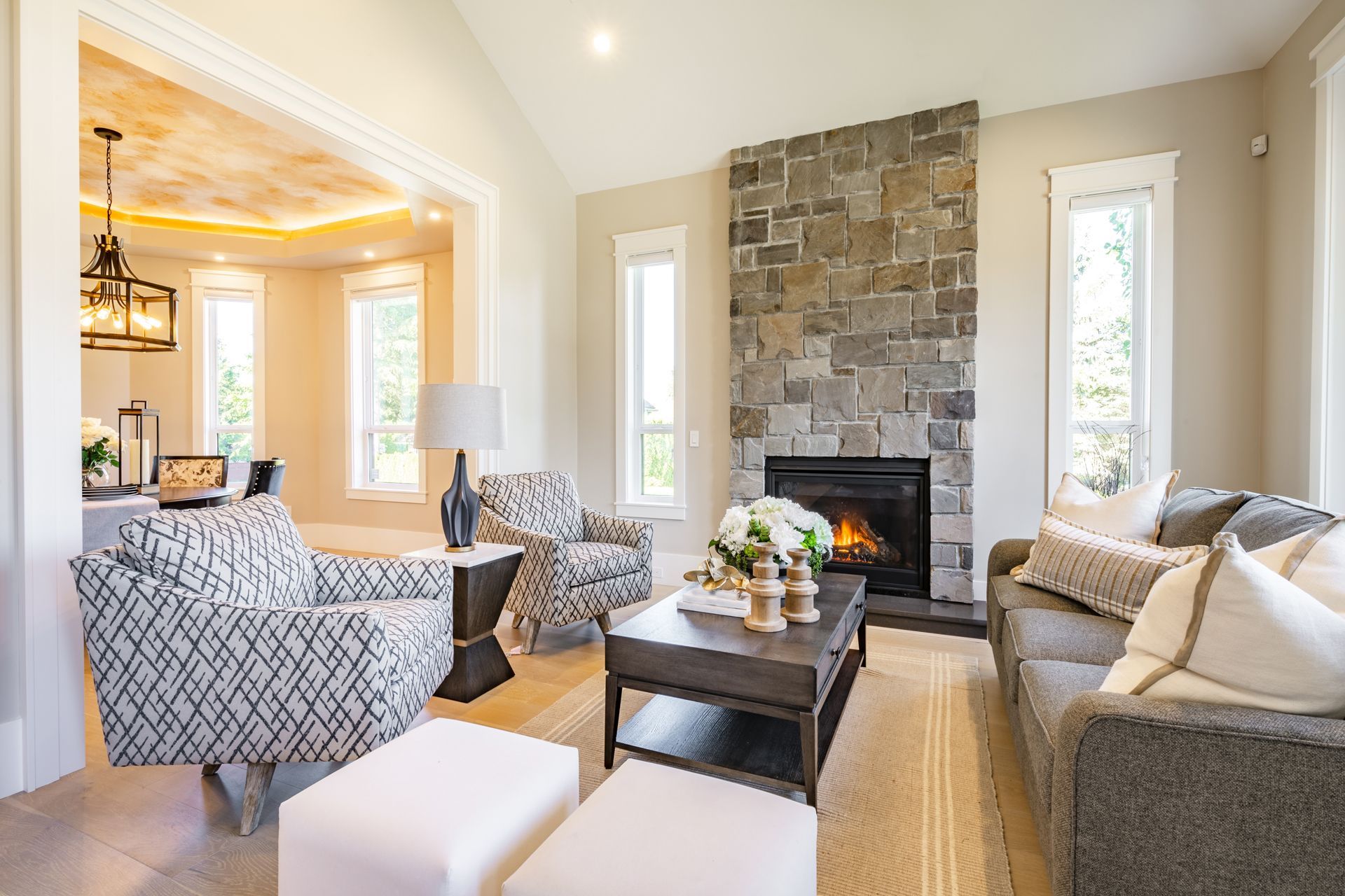 Living Room With a Couch, Chairs, Coffee Table, and Fireplace