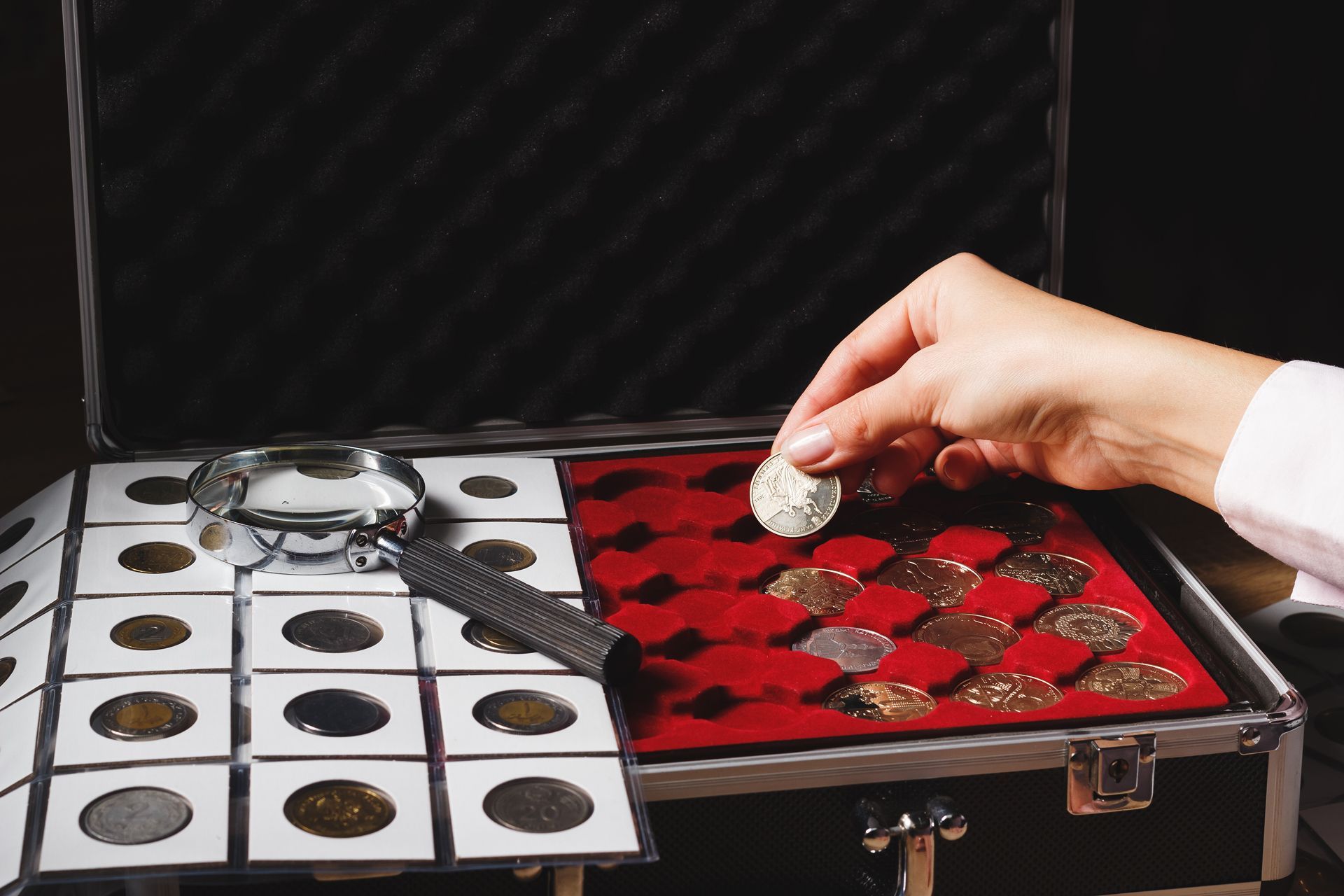 A Person is Taking a Coin Out of a Case