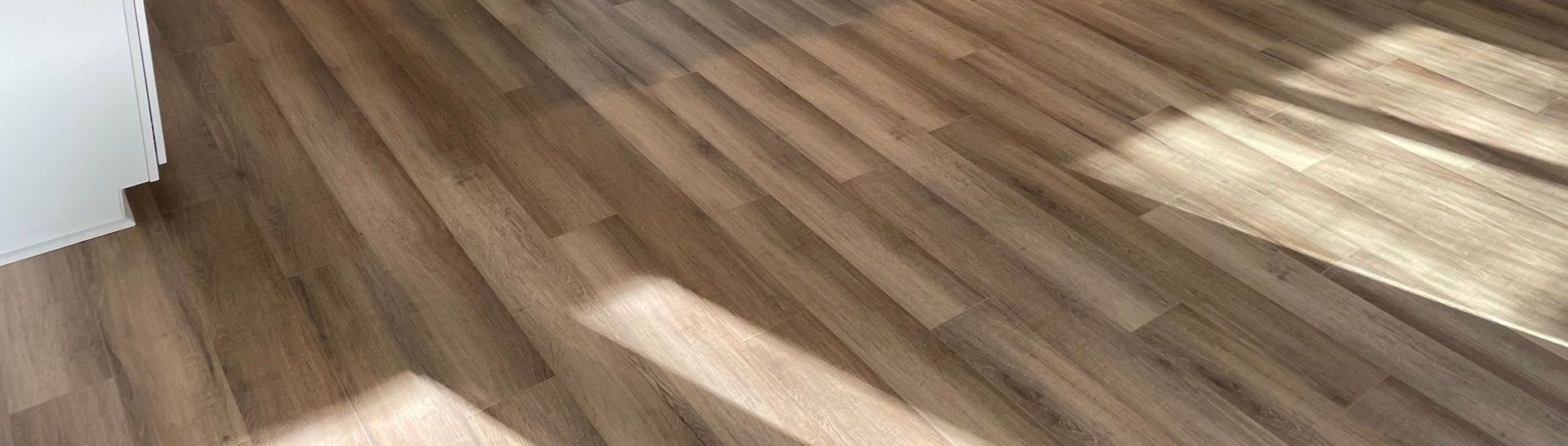 a bedroom with hardwood floors and a bed .