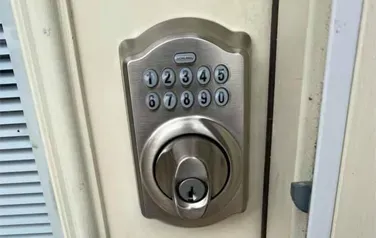 A close up of a digital lock on a door.