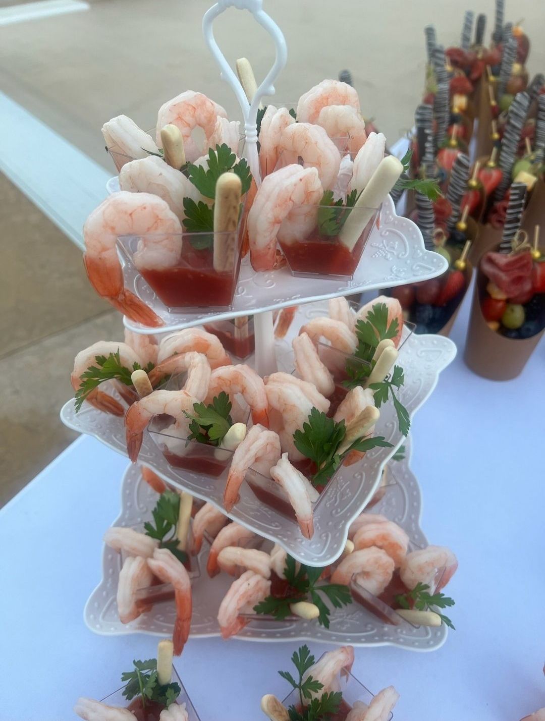 A tower of shrimp appetizers on a table