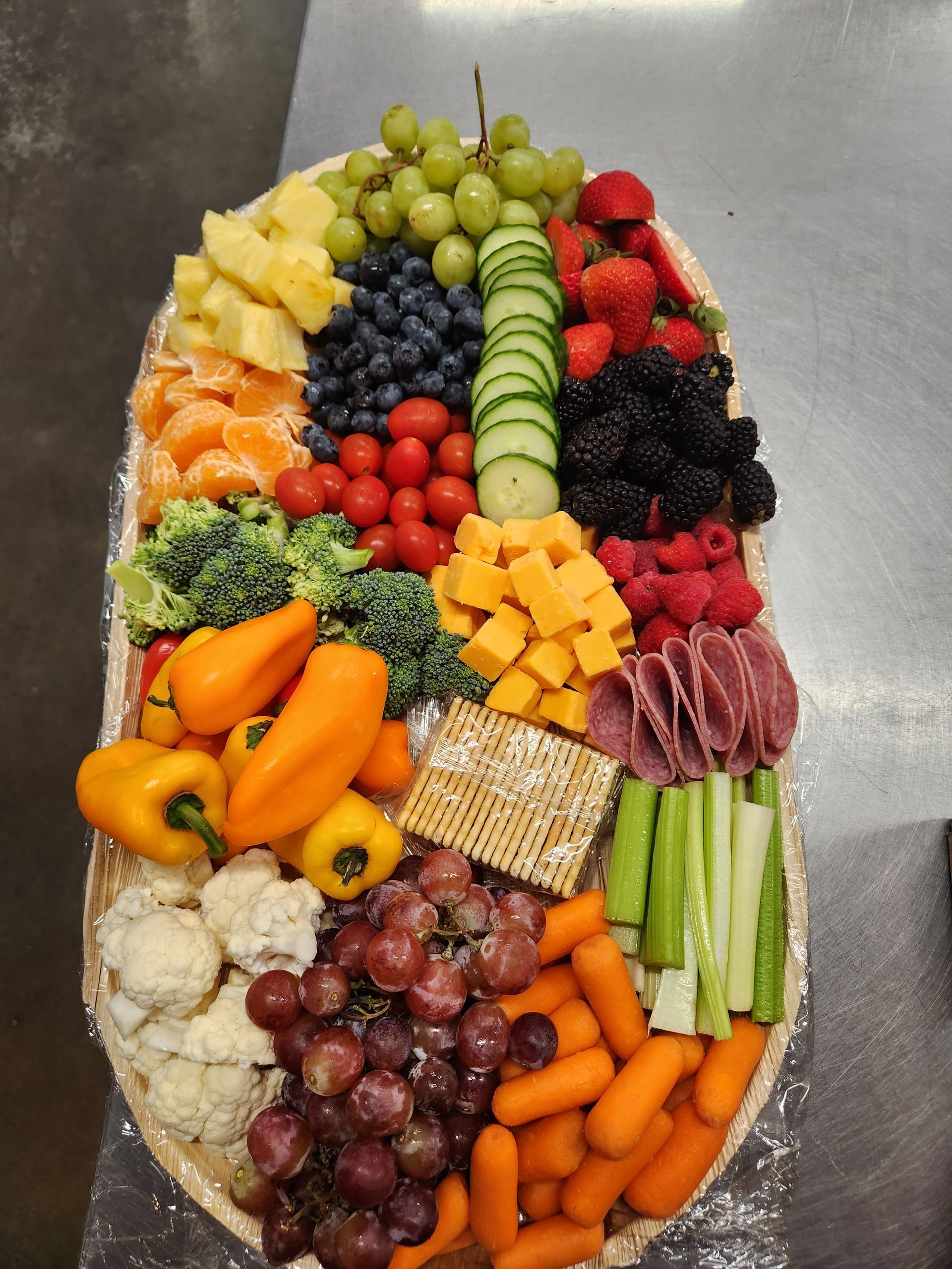 A tray of fruits and vegetables on a table
