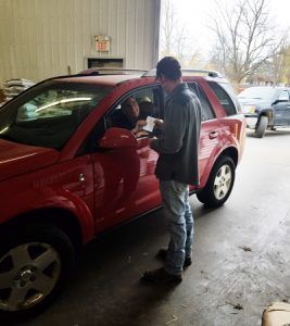 man picking up drive through order