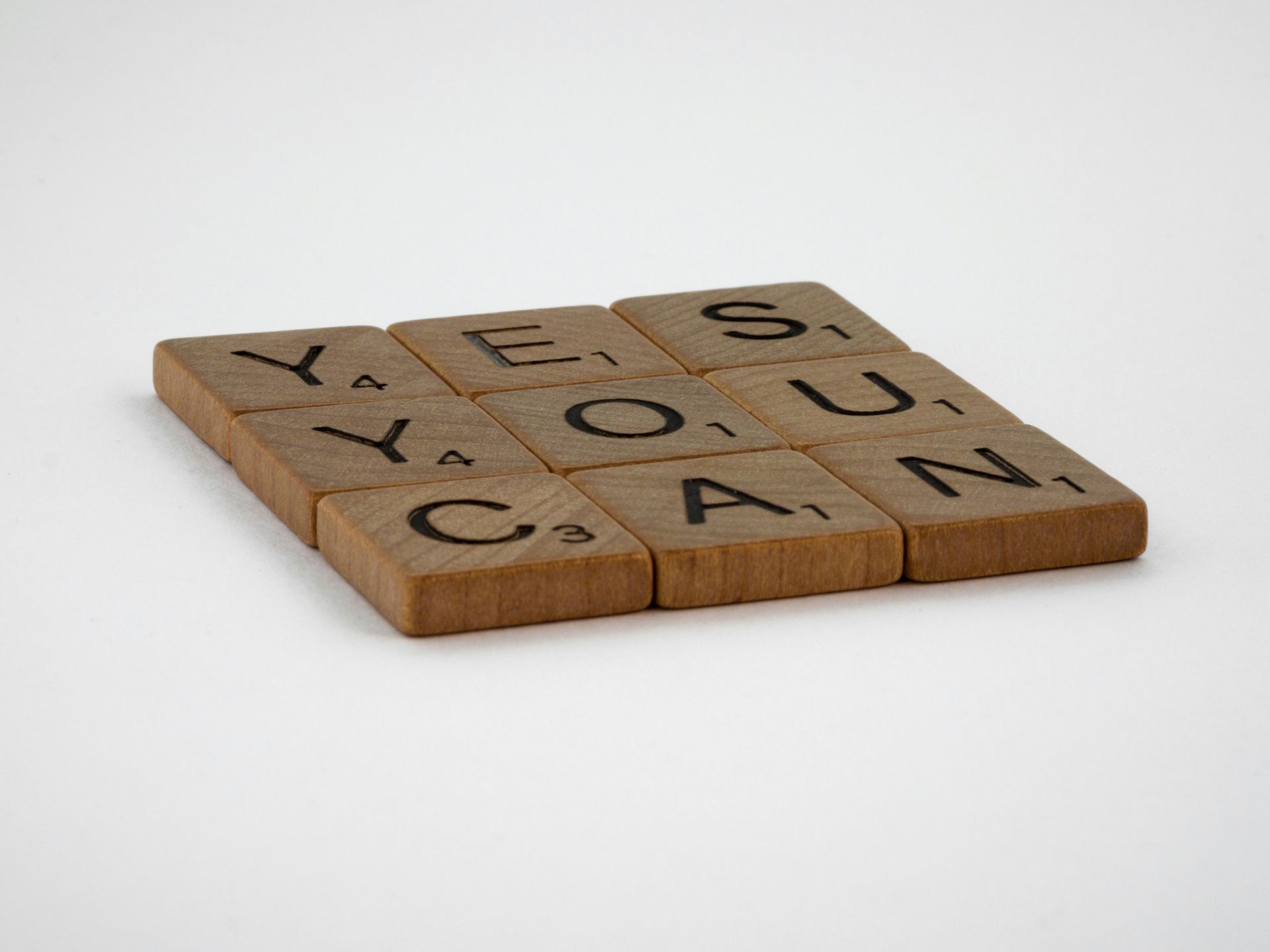 Wooden Scrabble tiles spell 