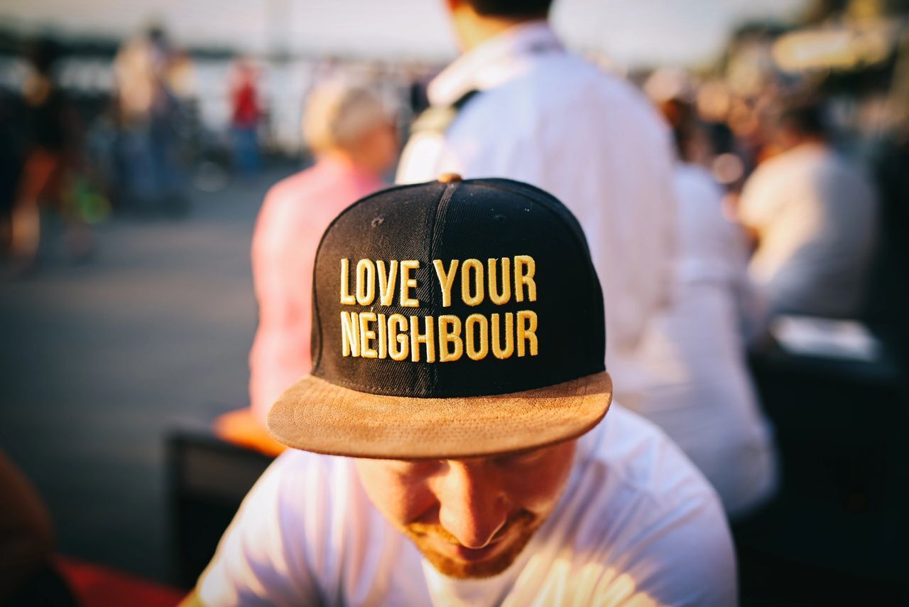 Person with Love Your Neighbour Cap — Los Angeles, CA — Los Angeles Metropolitan Churches
