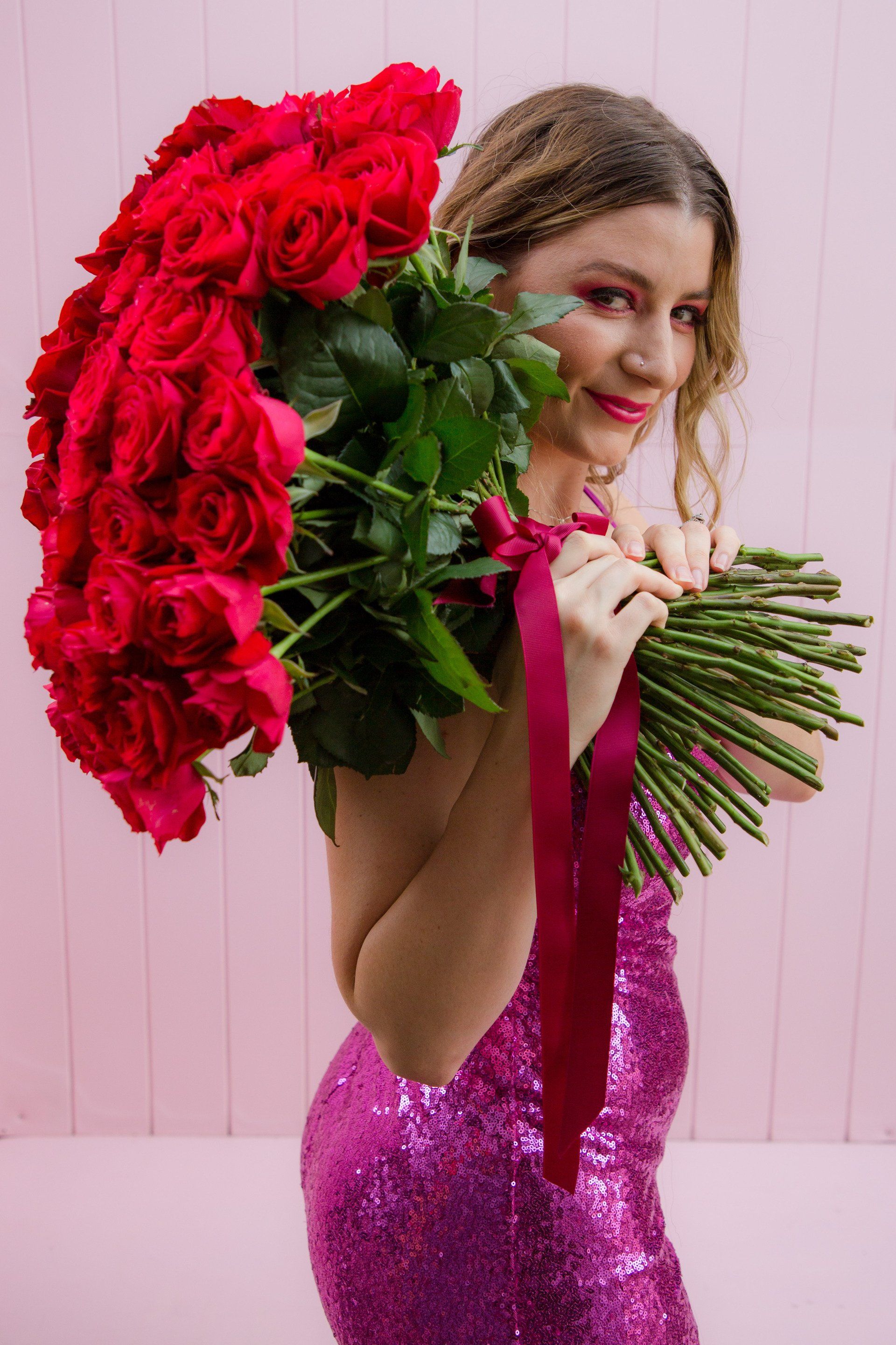 Person holding Stunning rose bouquet, highlighting the romance and charm of Darwin's floristry.