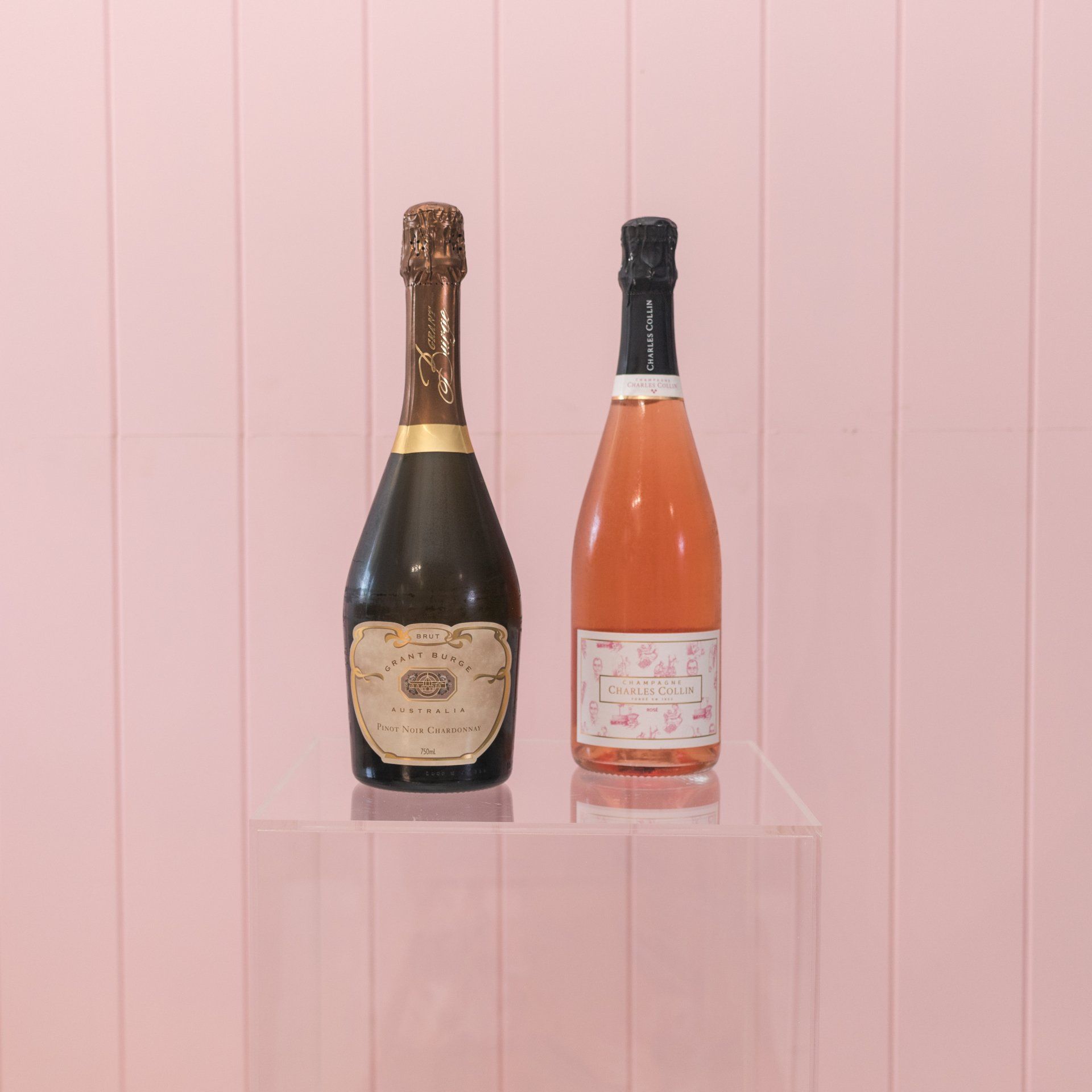 Chic white and pink champagne bottles, perfect for wedding toasts in Darwin.