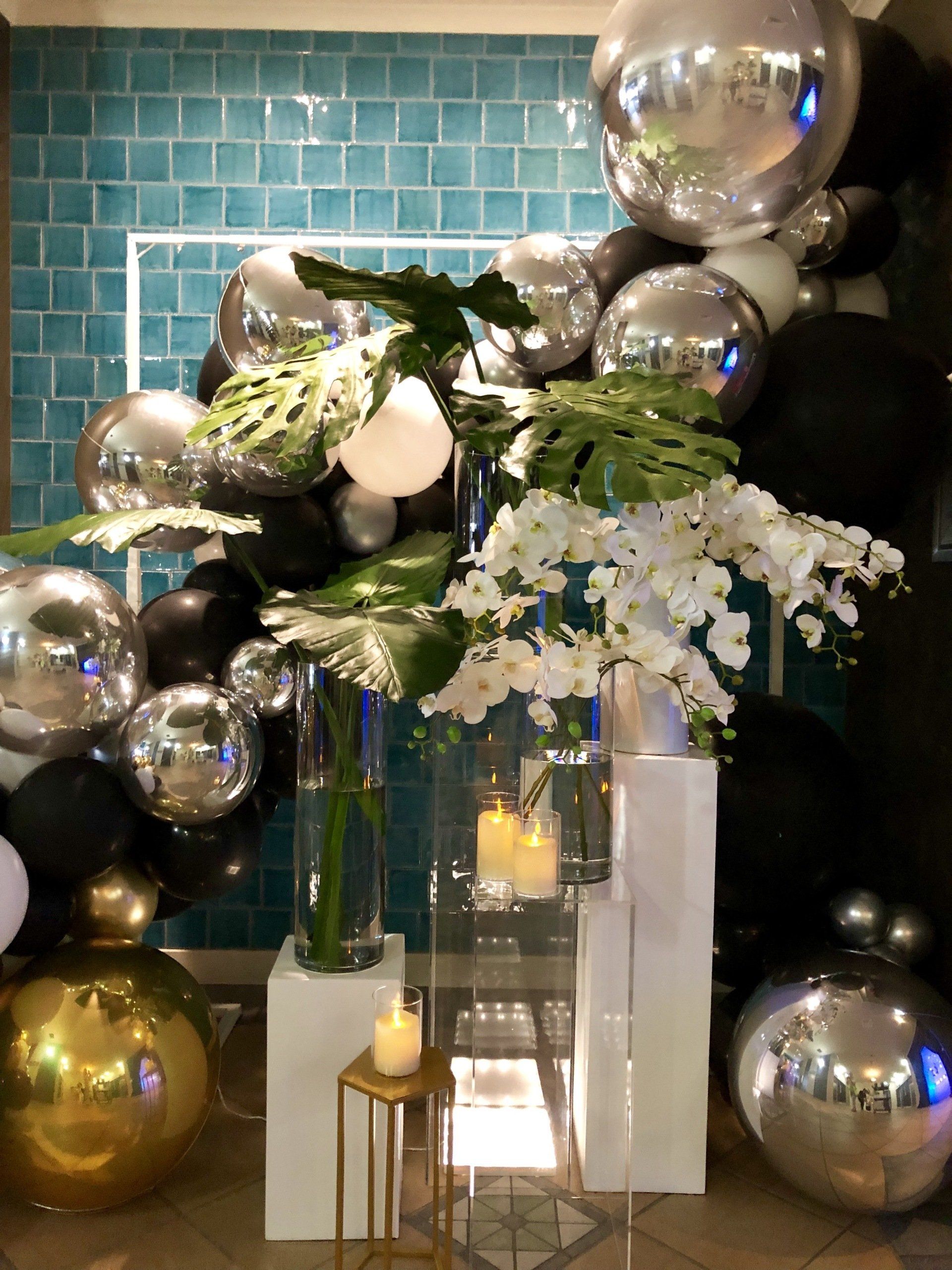 Sophisticated white and green floral arrangements for events, crafted by Darwin's floral experts.