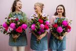 Florist arranging a vibrant bouquet with fresh flowers in Darwin, NT.