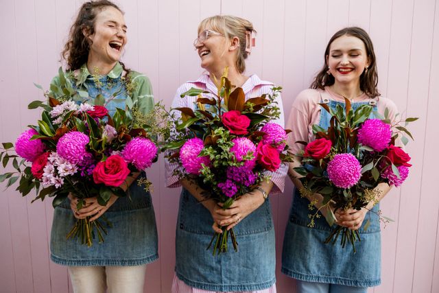 Florist arranging a vibrant bouquet with fresh flowers in Darwin, NT.