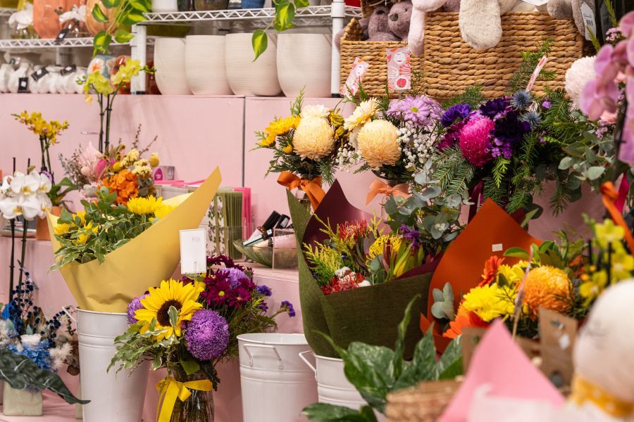 Cherished moments captured with a lady holding baby toys, a gift from Darwin's wedding collection.