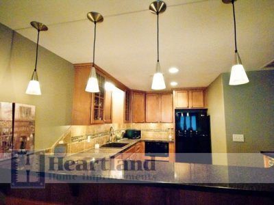 A kitchen with a sign that says heartland home improvements