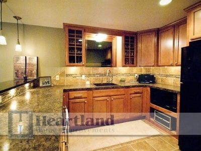 A kitchen with a sign that says love on it