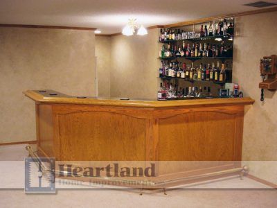 A bar in a basement with a heartland logo on the bottom