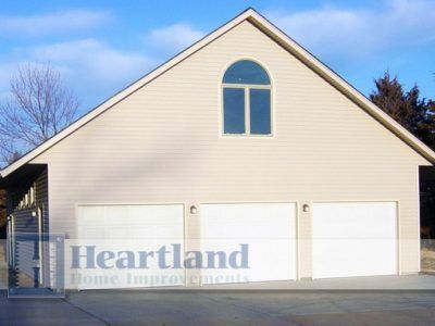 A large house with a heartland logo on it