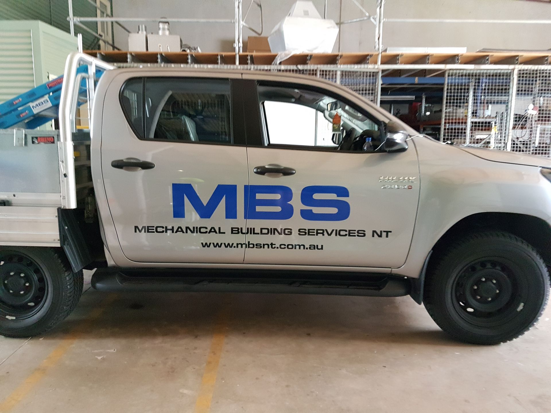 A Pharmacy With Balloons In Front Of It — Northern Territory Sign Services in Winnellie, NT
