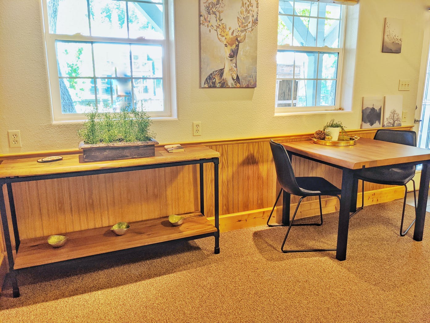 There is a table and chairs in the room.