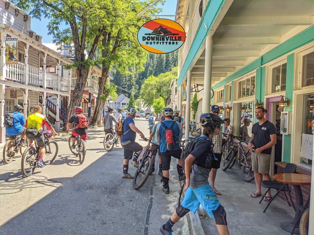 A group of people are riding bicycles down a city street.